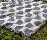 Demi Geometric Cotton Throw Blanket in Gray, outdoors