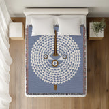 Mossi African Mask 100% Cotton Blanket in Light Blue, on a bed