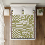 Cocodili Abstract Print Cotton Throw Blanket in Chartreuse, on a bed