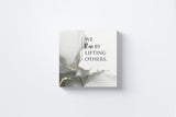 We Rise by Lifting Others Canvas Wall Art in Gray, square