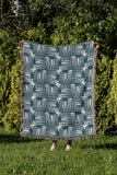 Hami Cotton Throw Blanket in Teal, outdoors