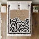 Acor Abstract Cotton Blend Blanket Throw in Beige and Off-White, on a bed