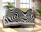 Acor Abstract Cotton Blend Blanket Throw in Yellow and Off-White, draped over a chair