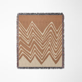 Addai Abstract Triangle Pattern Blanket Throw in Rust and Beige, laid flat