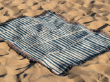 Afia Tribal Cotton Throw Blanket in Blue and Beige, outdoors