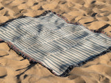 Afia Tribal Cotton Throw Blanket in Gray and Beige, outdoors