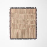 Afia Tribal Cotton Throw Blanket in Rust and Beige, laid flat