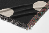 Akon Hand Woven Throw Blanket in Black and Beige, side view