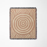 Alaka Circles Cotton Throw Blanket in Rust and Beige, laid flat