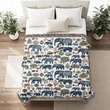 Alfie Elephant Cotton Blend Blanket Throw in Blue and Off-White, on a bed