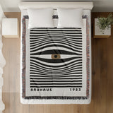 Bauhaus Eye Abstract Cotton Blend Blanket Throw in Beige, Black and Off-White, on a bed