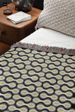 Alo Cotton Blend Blanket Throw in Black, on a bed