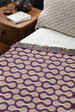 Alo Cotton Blend Blanket Throw in Purple, on a bed