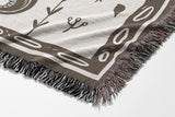 Amiro Crocodile Cotton Blend Blanket Throw in Beige and Off-White, draped over a chair