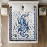 Amiro Crocodile Cotton Blend Blanket Throw in Blue and Off-White, on a bed