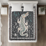 Amiro Crocodile Cotton Blend Blanket Throw in Gray and Off-White, on a bed