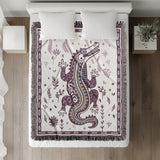 Amiro Crocodile Cotton Blend Blanket Throw in Purple and Off-White, on a bed