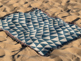 Asaba Abstract Cotton Throw Blanket in Blue and Beige, outdoors