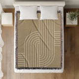 Askii Cotton Blend Blanket Throw in Beige, on a bed