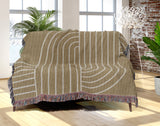 Askii Cotton Blend Blanket Throw in Beige, draped over a chair