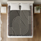 Askii Cotton Blend Blanket Throw in Gray, on a bed