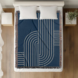 Askii Cotton Blend Blanket Throw in Navy Blue, on a bed