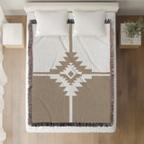 Asko Southwestern Cotton Blend Blanket Throw in Beige and Off-White, on a bed
