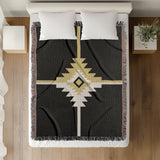 Asko Southwestern Cotton Blend Blanket Throw in Black, Off-White and Dull Gold, on a bed