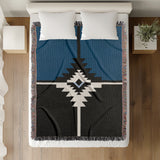 Asko Southwestern Cotton Blend Blanket Throw in Blue, Black and Off-White, on a bed
