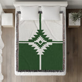 Asko Southwestern Cotton Blend Blanket Throw in Green and Off-White, on a bed