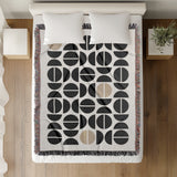 Barro Abstract Cotton Blend Blanket Throw in Beige, Black and Off-White, on a bed