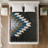 Bimisii Southwestern Cotton Blend Blanket Throw in Blue, Brown, Black and Off-White, on a bed
