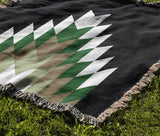 Bimisii Southwestern Cotton Blend Blanket Throw in Green, Brown and Off-White, draped over a chair