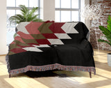 Bimisii Southwestern Cotton Blend Blanket Throw in Red, Brown, Black and Off-White, draped over a chair