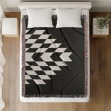 Bimisii Southwestern Cotton Blend Blanket Throw in Black and Off-White, on a bed