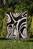 Binitie Zebra Print Cotton Throw Blanket in Black and Beige, laid flat