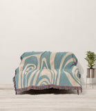Binitie Zebra Print Cotton Throw Blanket in Blue and Beige, draped over a sofa