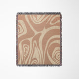 Binitie Zebra Print Cotton Throw Blanket in Rust and Beige, laid flat