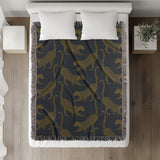 Bolt Leopard Cotton Blend Blanket Throw in Slate Gray and Off-White, on a bed