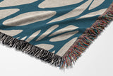 Buga Abstract Print Cotton Throw Blanket in Blue and Beige, side view