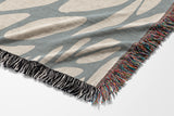 Buga Abstract Print Cotton Throw Blanket in Gray and Beige, side view