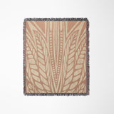Buga Abstract Print Cotton Throw Blanket in Rust and Beige, laid flat