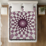 Bullseye Abstract Cotton Blend Blanket Throw in Purple and Off-White, on a bed