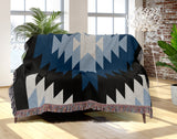 Caca Southwestern Cotton Blend Blanket Throw in Blue, Black and Off-White, draped over a chair