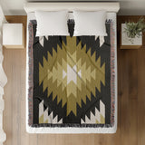 Caca Southwestern Cotton Blend Blanket Throw in Black, Dull Gold and Off-White, on a bed