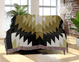 Caca Southwestern Cotton Blend Blanket Throw in Black, Dull Gold and Off-White, draped over a chair