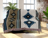 Carlos Southwestern Cotton Blend Blanket Throw in Blue, Black, Dull Gold and Off-White, draped over a chair