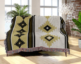 Carlos Southwestern Cotton Blend Blanket Throw in Black, Dull Gold and Off-White, draped over a chair