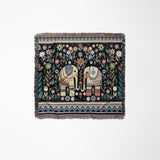 Cece Elephant Cotton Blend Blanket Throw in Black, Green and Yellow, laid flat