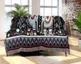 Cece Elephant Cotton Blend Blanket Throw in Black, Blue and Red, draped over a chair